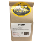 A brown, 2 pound bag of gluten free flour mix. 