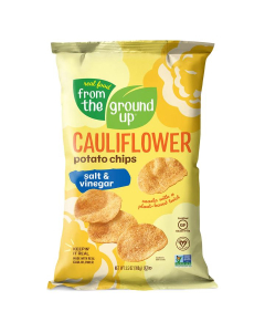 A yellow bag of Real Food From The Ground Up Cauliflower Potato Chips in the Salt & Vinegar flavor. Bag reads, "Snacks with a plant-based twist."