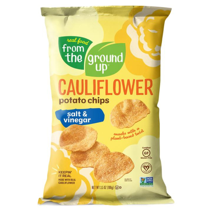 A yellow bag of Real Food From The Ground Up Cauliflower Potato Chips in the Salt & Vinegar flavor. Bag reads, "Snacks with a plant-based twist."