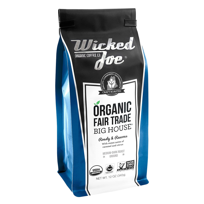 A black and cobalt blue bag of organic fair trade coffee.